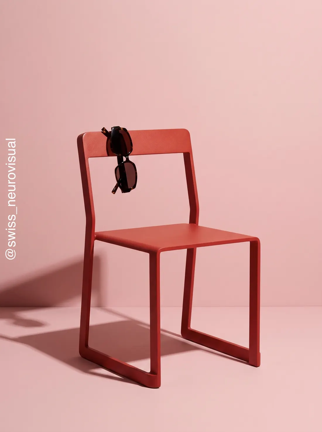 AI photography — eyewear on red chair